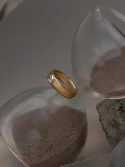 Gold Ring with Oval-encrusted Gemstone - Clear