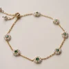 Petite Pearl Flower Bracelet With Emerald Gemstones